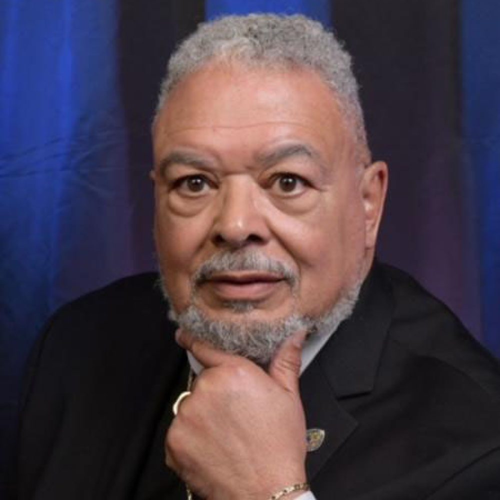 Robert E White